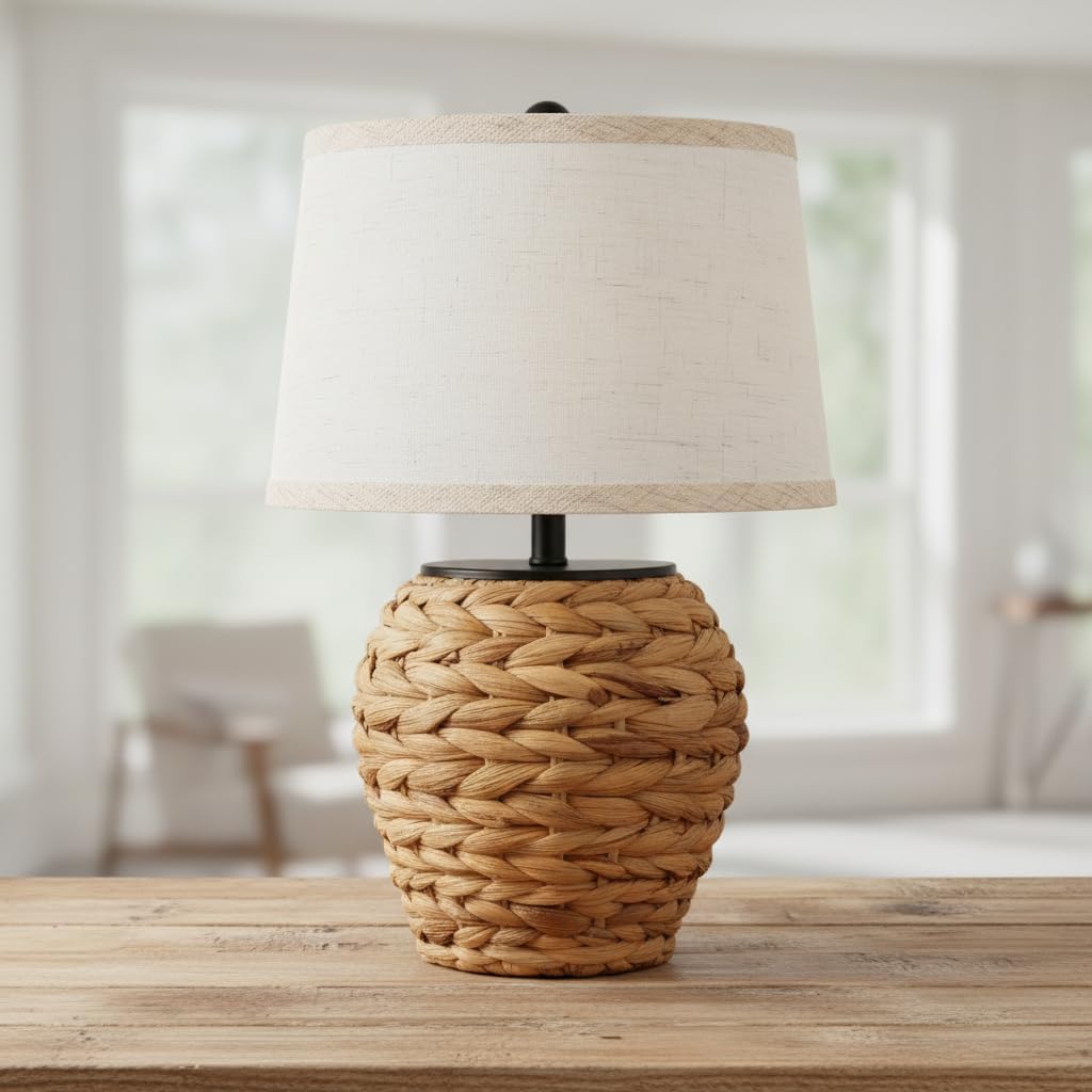 Table lamp with a textured woven base and light fabric shade