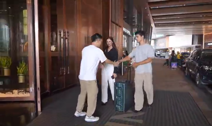 Ivan welcoming overseas visitors in an original visit-video frame